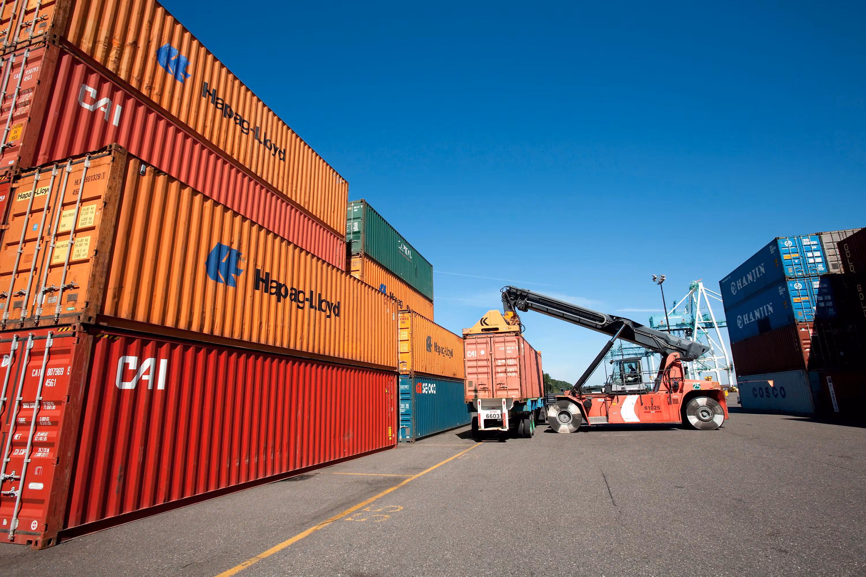 Shipping containers stacked at a port.
